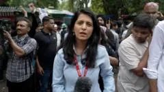 Protesters celebrate India's education minister exit