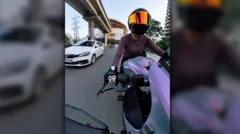 Indian police detain driver who hit female biker in viral video