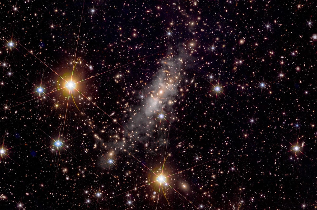 new image of galaxy cluster Abell 2390, a giant conglomeration of many galaxies like the Milky Way. new image of galaxy cluster Abell 2390, a giant conglomeration of many galaxies like the Milky Way.